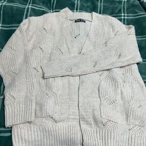 Mid-length cardigan with pockets oatmeal color